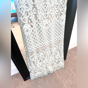 Long lace dress . Color is a very light mint . Never used .